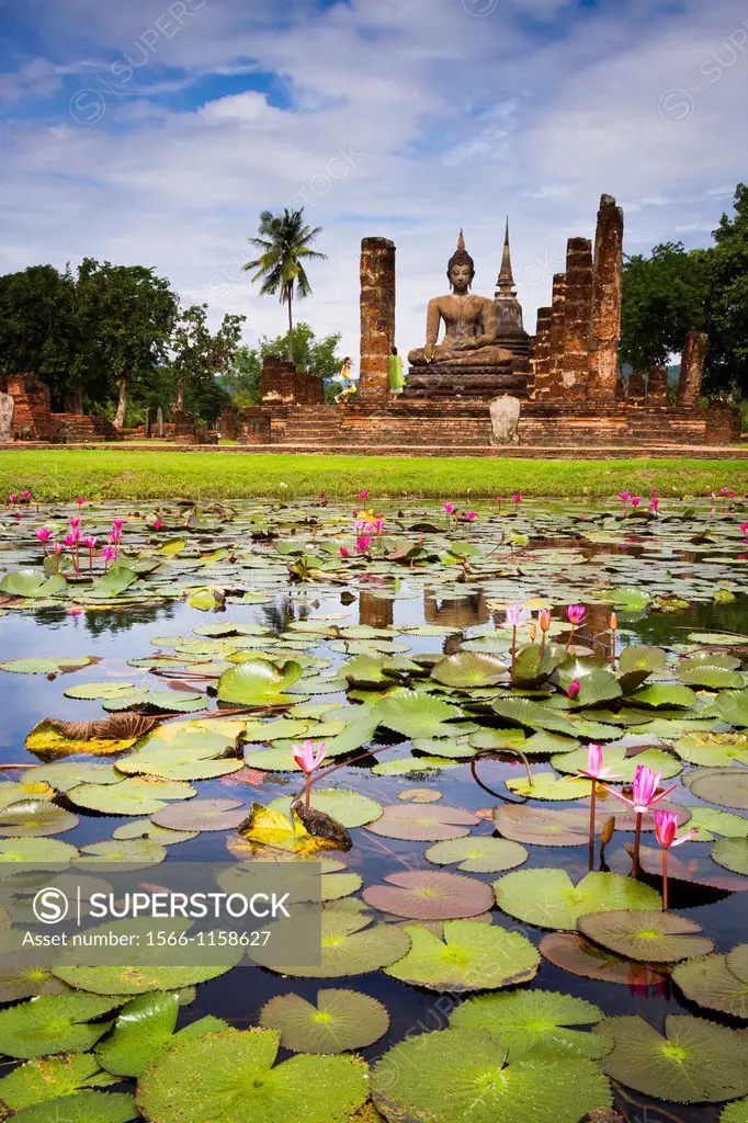 Buddha statue and pool  Wat Mahathat  Sukhothai Historical Park  Thailand