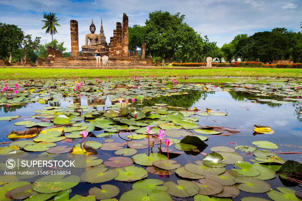 Buddha statue and pool  Wat Mahathat  Sukhothai Historical Park  Thailand