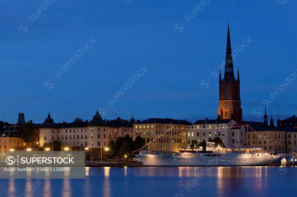Riddarfjärden with Klara Church and ship at night, Stockholm, Sweden