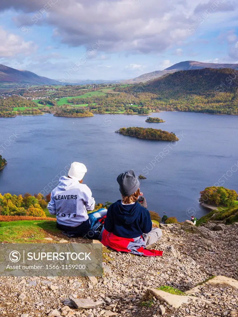 Teenage brother and sister enjoying the view over Derwent Water from Catbells in the Lake District  Keswick, Cumbria, United Kingdom