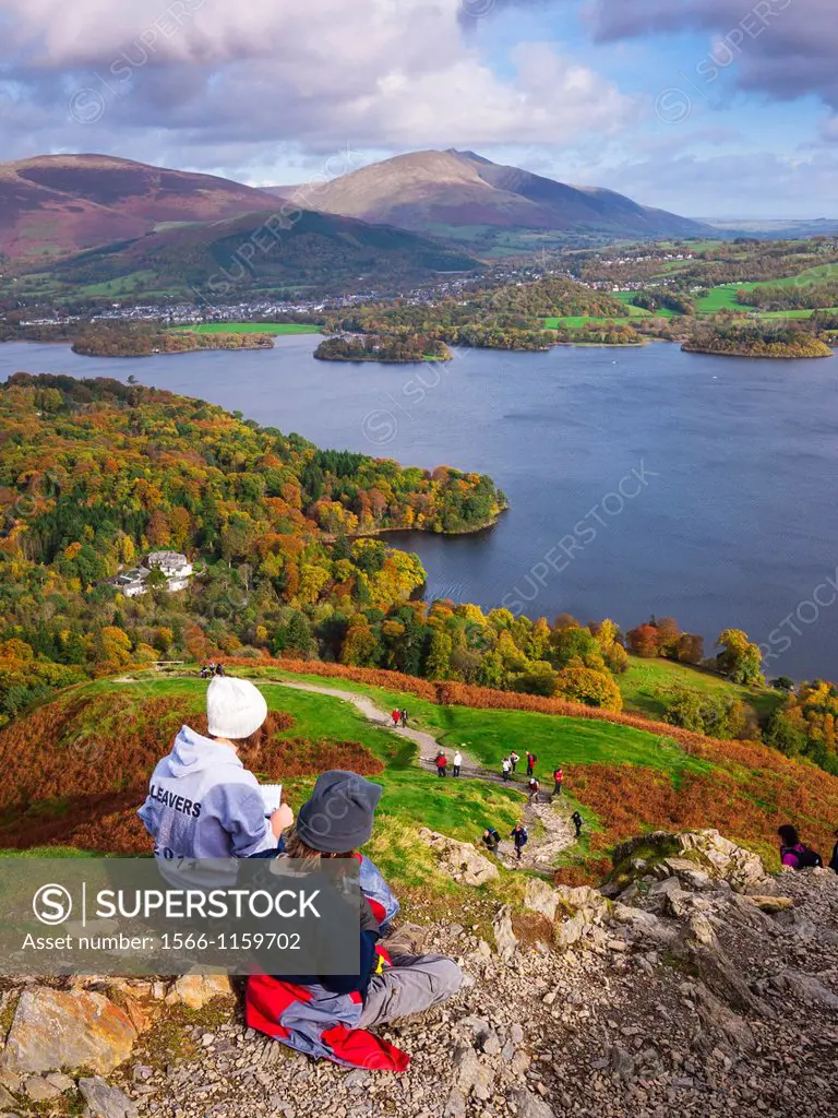 Teenage brother and sister enjoying the view over Derwent Water from Catbells in the Lake District  Keswick, Cumbria, United Kingdom