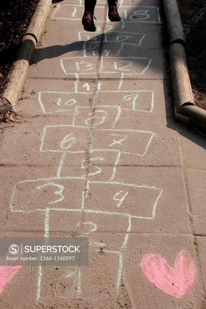 Playing on a hopscotch lane with hearts