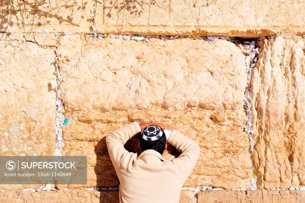 A Jewish man prays at the Western Wall in the old city of Jerusalem, Israel
