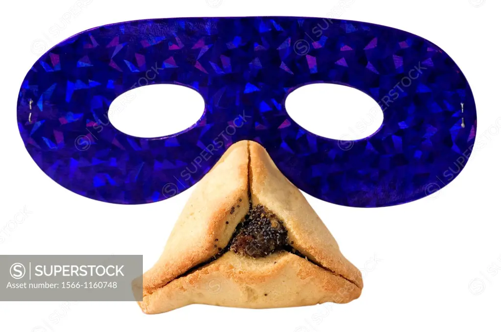 Hamantashen, traditional pastry and a party mask for the Jewish holiday of Purim