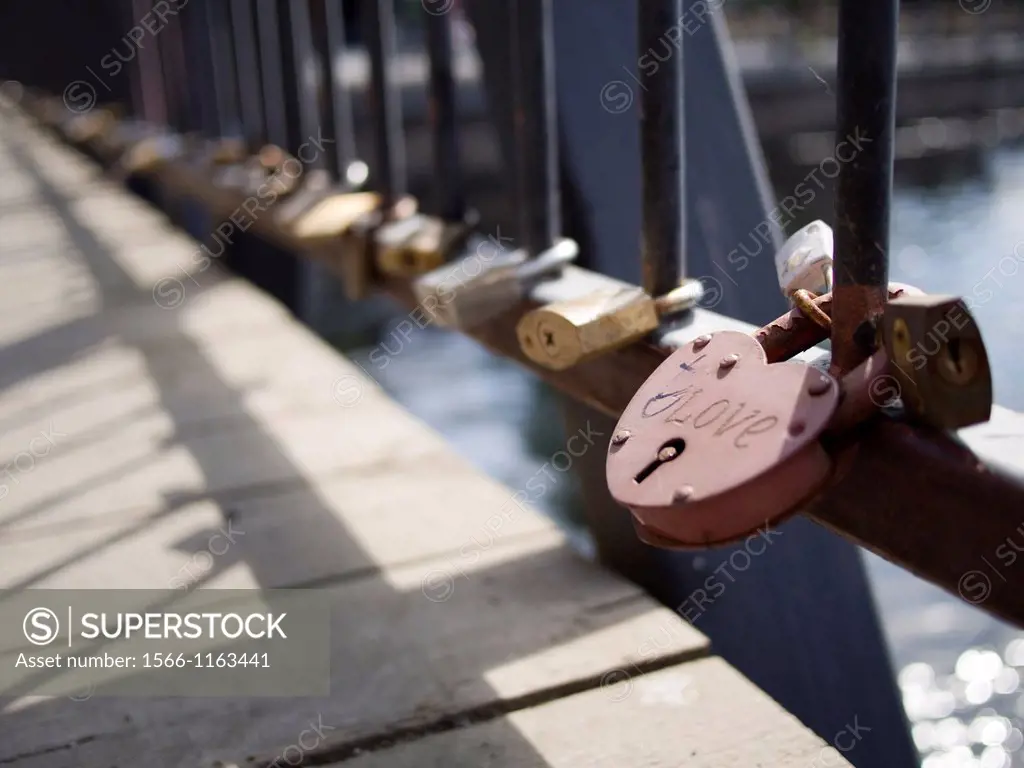 Locks left by romancing couples attached to bridge in accordance with local custom in Tampere, Finland