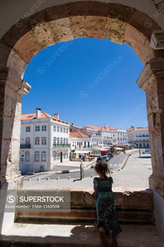 Girl looking at Largo Nossa Senhora da Nazare from the Church of Nossa Senhora da Nazare, Sitio, Nazare, Oeste, Leiria District, Portugal.
