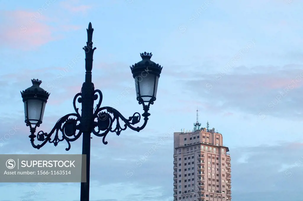 Street lamp and Madrid Tower at dawn. Madrid, Spain.