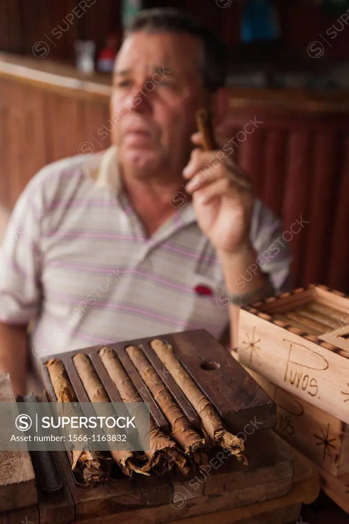 Cuba, Pinar del Rio Province, Vinales, Vinales Valley, tobacco planter smoking Cuban cigar, NR