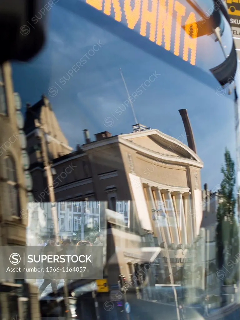 Cityscape reflected in bus window in Tampere, Finland