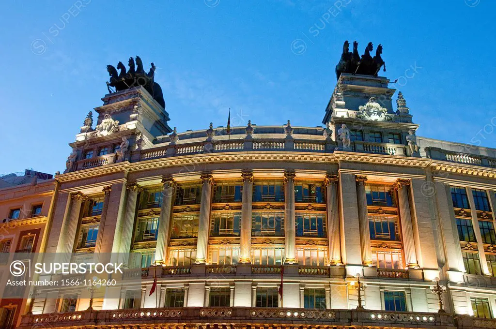 Facade of Cuadrigas building, night view. Madrid, Spain.