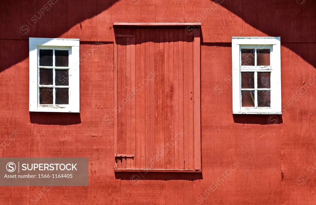 Rustic Red Barn Door with Two White Wood Windows