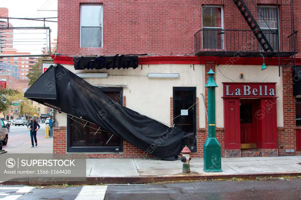 NEW YORK, NY - OCTOBER 30, 2012: Fallen awning at a business in East Midtown, New York, NY, on October 30, 2012, the day after hurricane Sandy hit the...