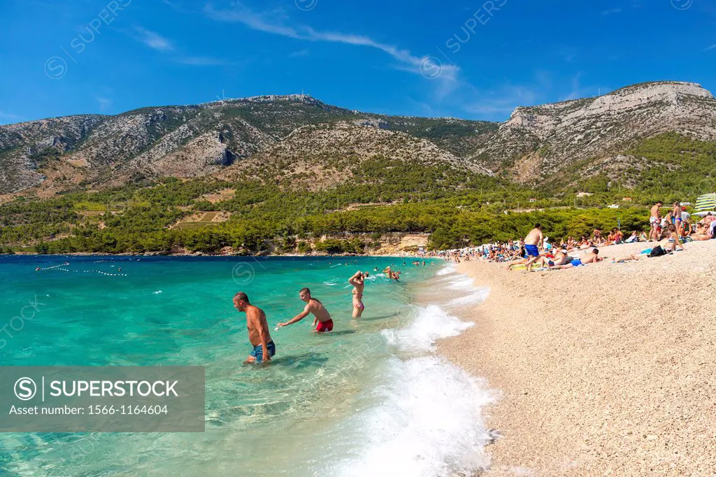 Tourists on Zlatni Rat beach in Bol on Brac island, Croatia