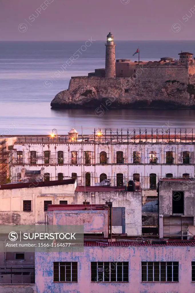 Cuba, Havana, elevated city view above Paseo de Marti towards Castillo de los Tres Santos Reyes del Morro, dawn