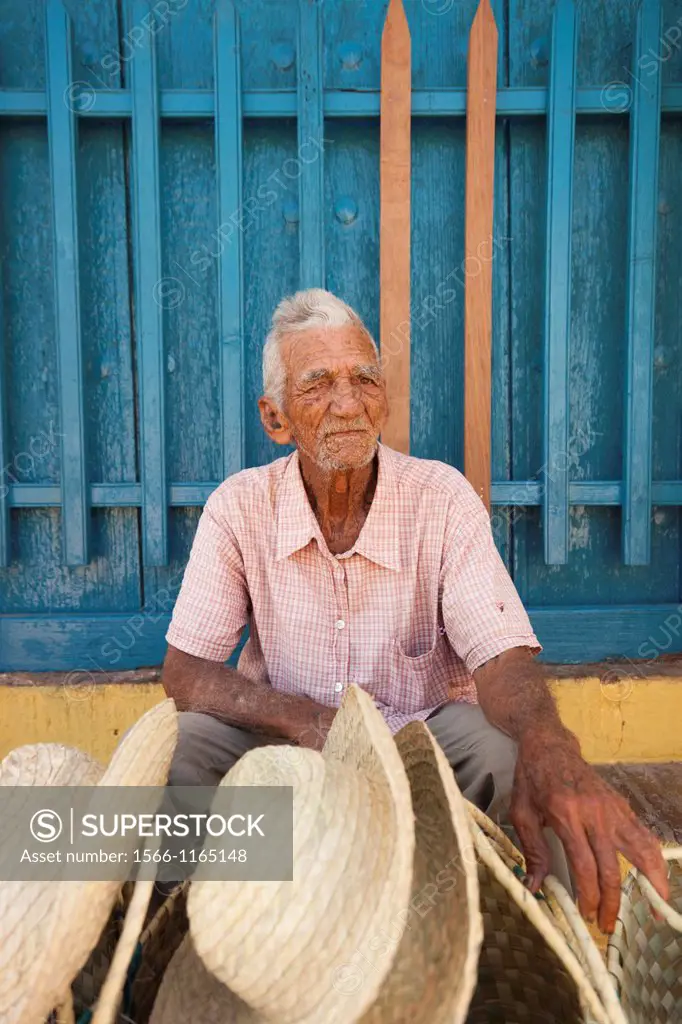 Cuba, Sancti Spiritus Province, Trinidad, hat seller, older Cuban man, NR