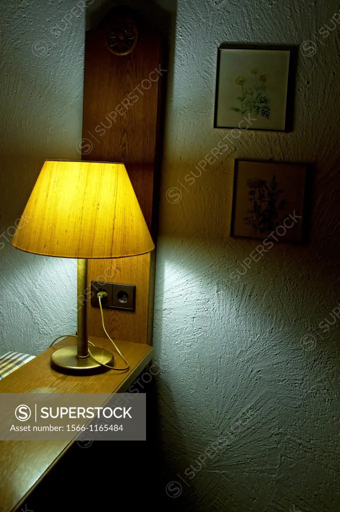small lamp lighting in interior, symbol of privacy at home