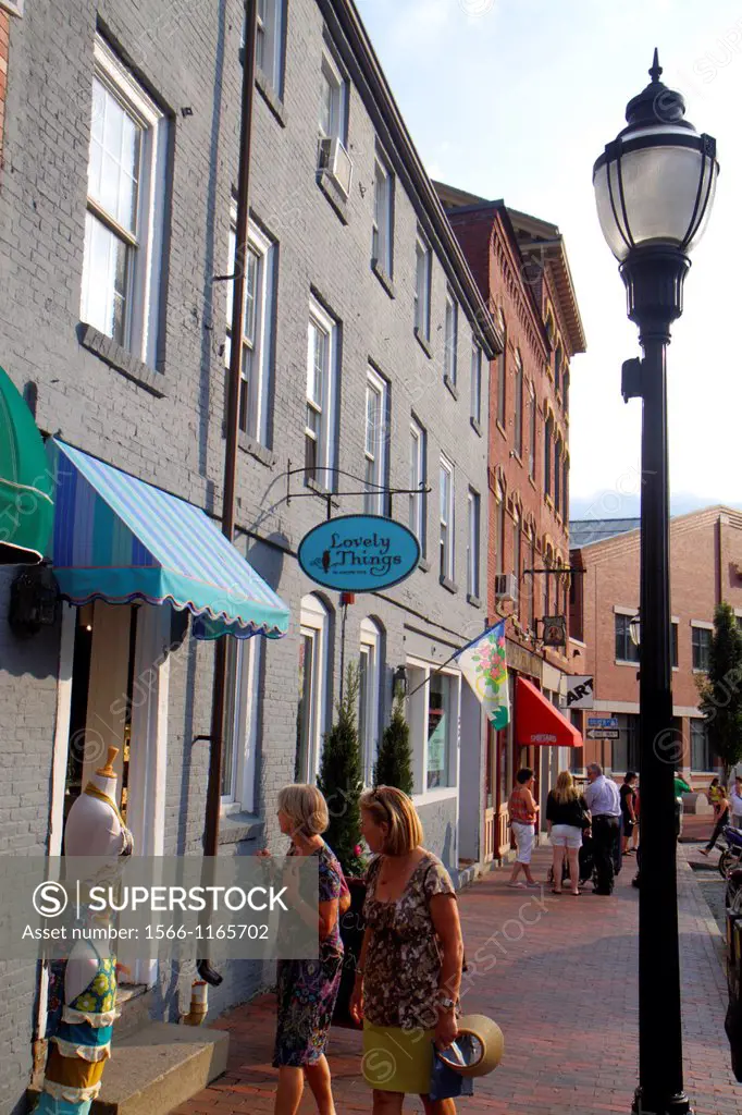 Maine, Portland, Historic Old Port District, Fore Street, businesses, signs, shopping, woman, lamppost,
