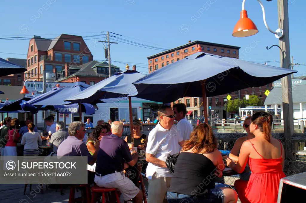 Maine, Portland, Historic Old Port District, Congress Street, Chandlers Wharf, Portland Lobster Company, alfresco dining, umbrellas, tables,