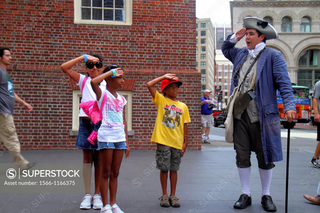Massachusetts, Boston, Washington Street, The Freedom Trail, Old State House, historic building, costumed re-enactor, actor, man, patriot, Black, boy,...