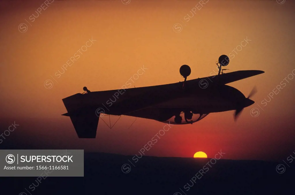 Aerobatic plane CR-100 flying at sunset, France
