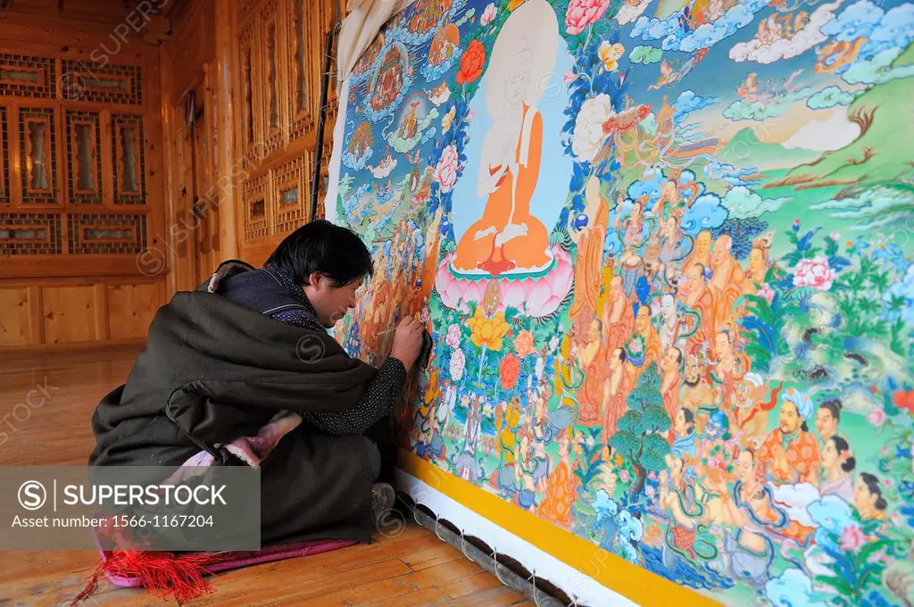 China, Qinghai, Amdo, Tongren Rebkong, Tibetan artist Shawo Thar painting a thangka
