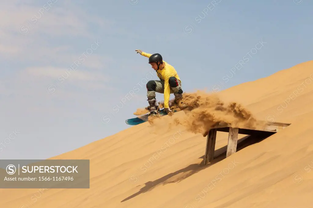 Sand boarding in the dunes of the Namib Desert near the coastal town of Swakopmund has become very popular  Swakopmund, Namibia