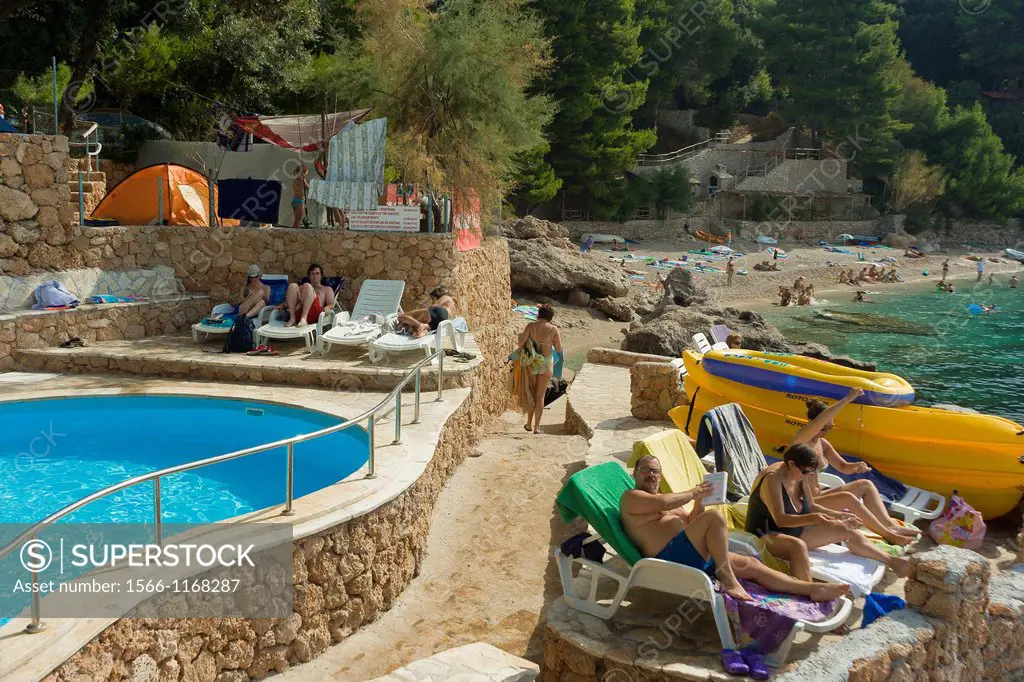 Tourists on Ponta campsite beach in Mokalo village, Peljesac Peninsula, Croatia