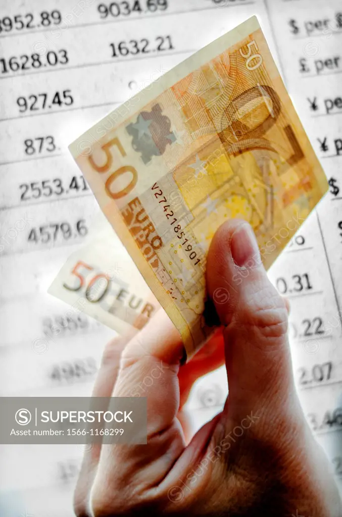 closeup of hand with 50 euro note on fund money market listing