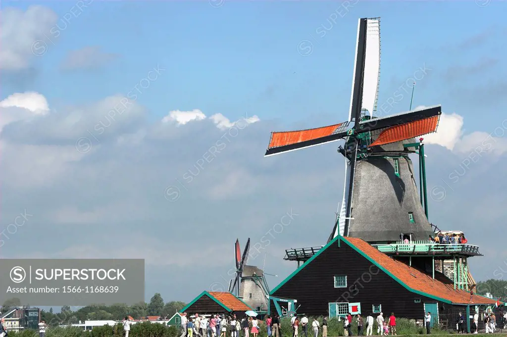 Visitors at Zaanse Schans working windmill museum village near Amsterdam The Netherlands