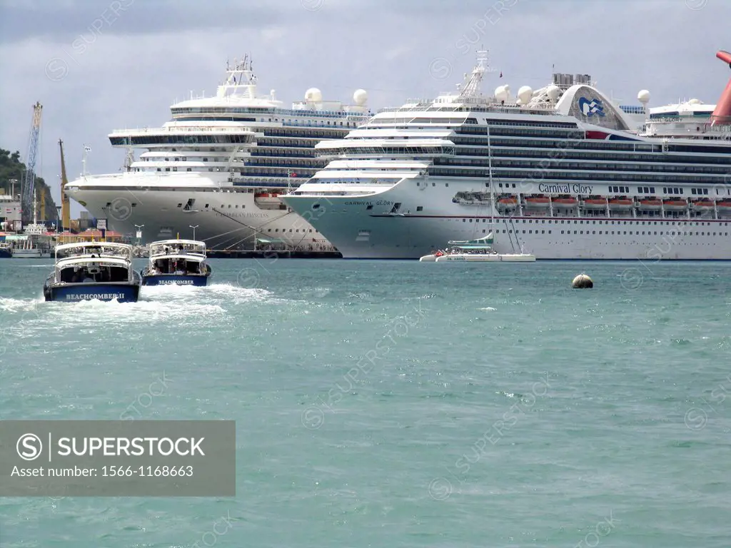 Water taxis return cruise ship visitors to Caribbean Princess left and Carnival Glory docked at Philipsburg St Maarten