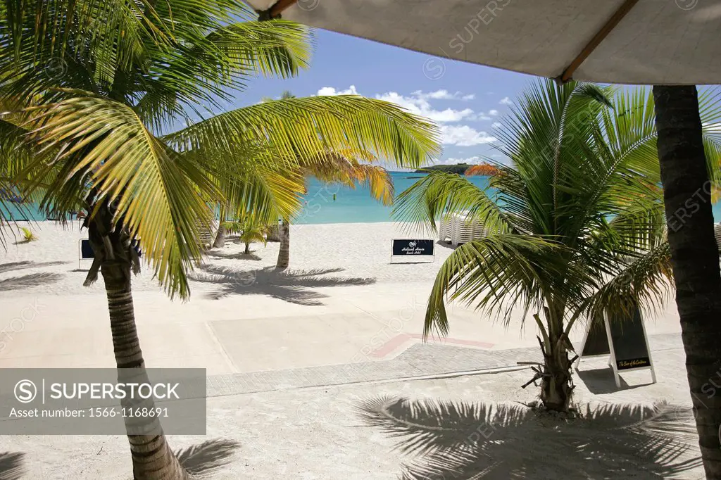Sun shade umbrella beside Great Bay beach promenade Holland House Beach Hotel Philipsburg St Maarten