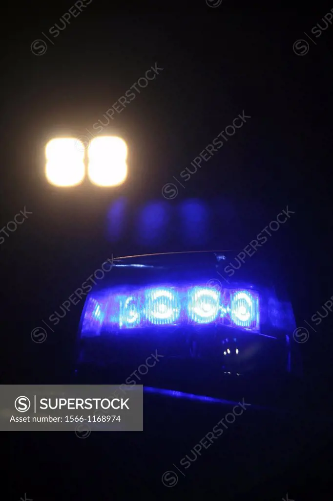 blue police car siren light at night