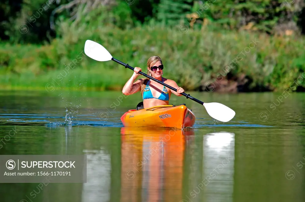 Kayaking on the North Fork of the Payette River near Payette Lake and the city of McCall in the Salmon River Mountains of central Idaho