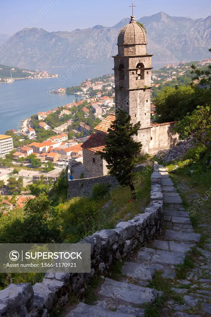 View from the medieval hill fortifications above Kotor across roof tops and Kotor Bay - Montenegro