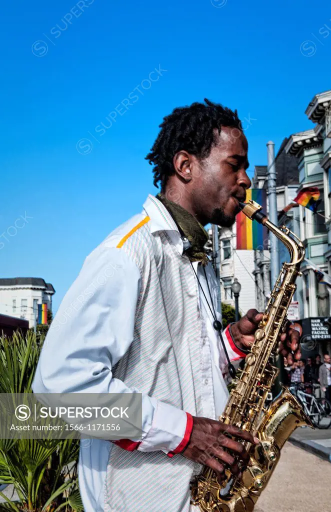 Black man playing sax in Gay Pride Weekend Pink Celebration in the gay Castro District of San Francisco California
