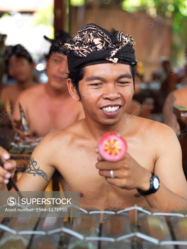 Indonesian men and boys playing traditional instruments