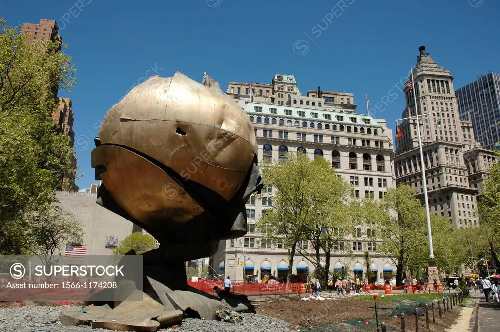 New York City, the remains of The Sphere that used to be by the Twin Towers, displayed to remember the 9/11 terrorist attack, at Battery Park
