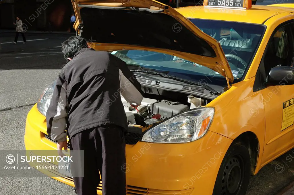New York City, a taxi driver fixing his cab