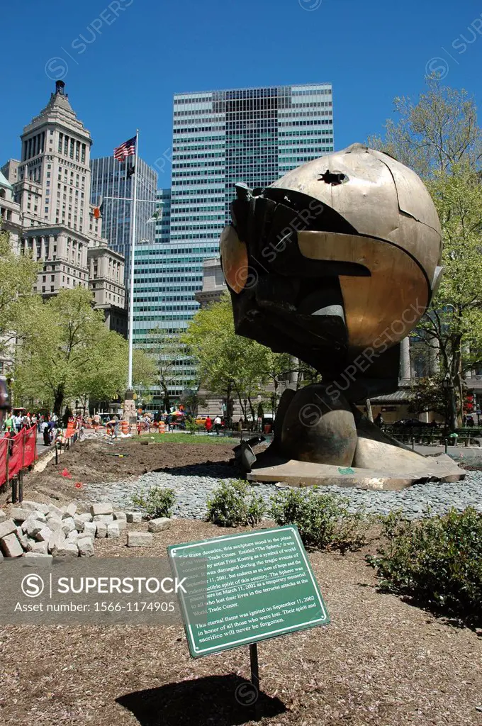 New York City, the remains of The Sphere that used to be by the Twin Towers, displayed to remember the 9/11 terrorist attack, at Battery Park