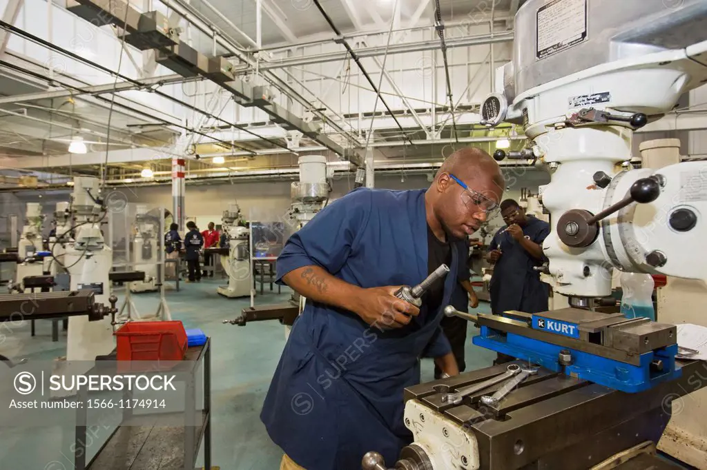 Detroit, Michigan - Worker operates a drill press at the Machinist Training Institute at the social service agency Focus: HOPE  MTI graduates have hel...