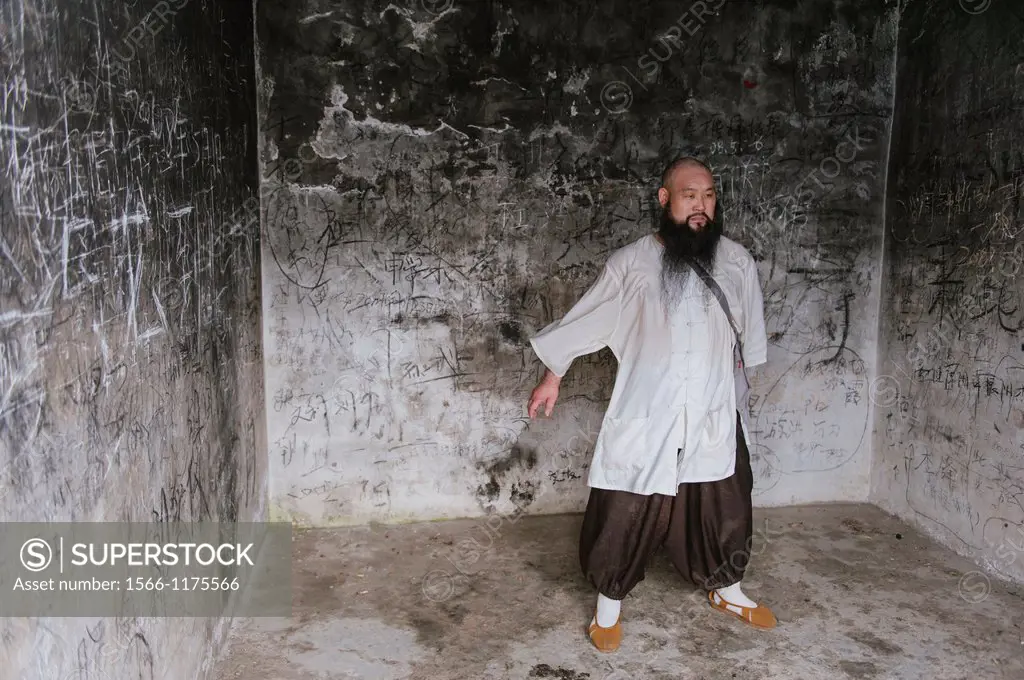 Shaolin monk, Shi De Chao poses for portraits and demonstrates various martial art techniques