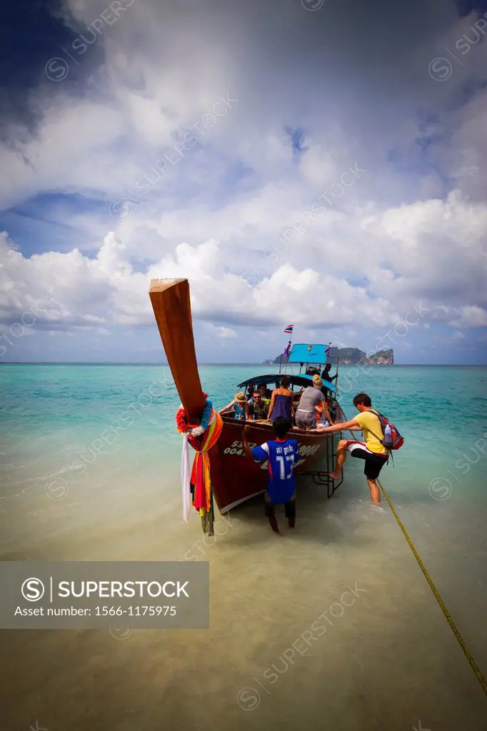 Longtail boat and tourists on Long beach  Phi Phi Don island  Krabi province, Andaman Sea, Thailand