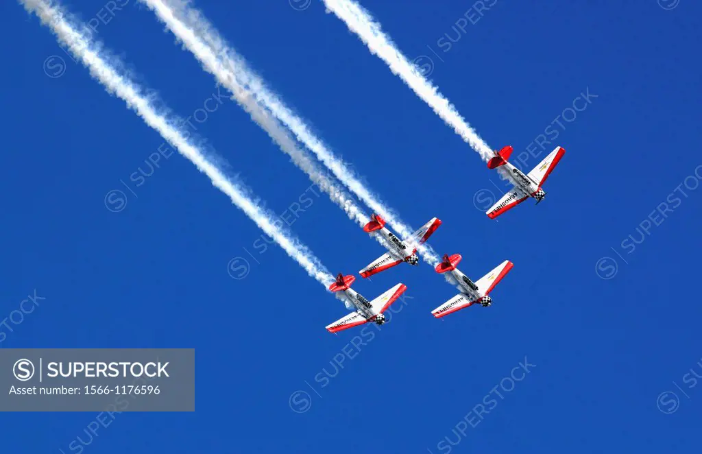 The planes of the Aeroshell demonstration team soar overhead in the blue skies of the Dayton Airshow
