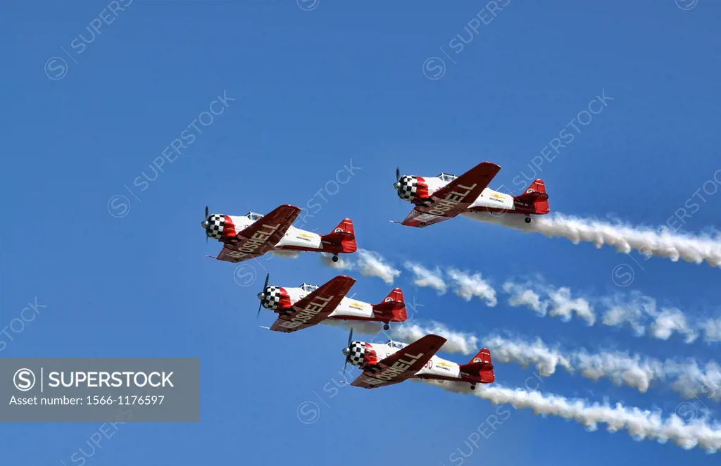 The Aeroshell demonstration team soars overhead in the blue skies of the Dayton Airshow
