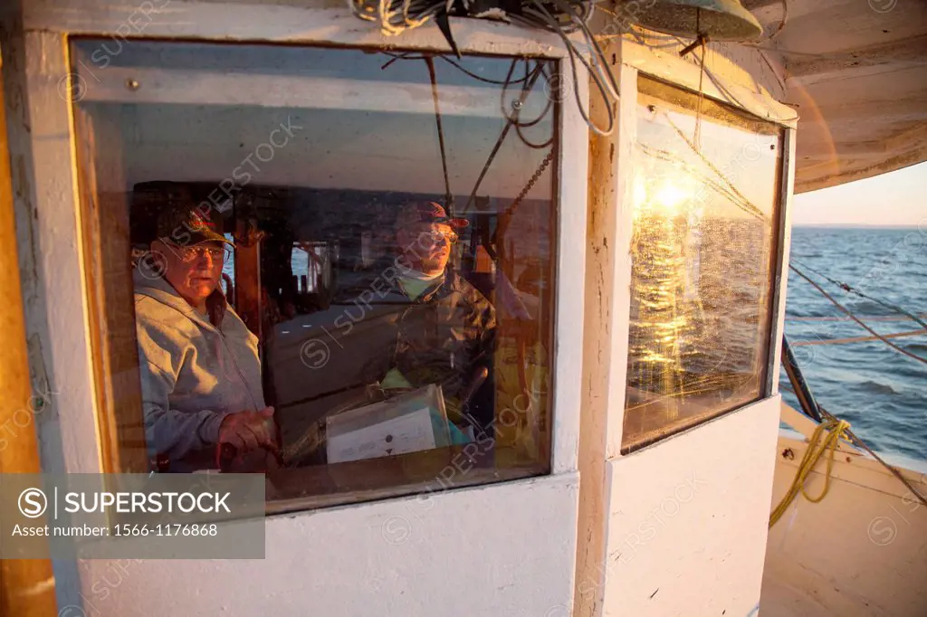 Mobile, Alabama - A shrimp trawler on Mobile Bay  Capt  Sid Schwartz right and his dad, Jackie Schwartz, pilot the 52-foot ´Capt  Sid´ at sunrise  The...