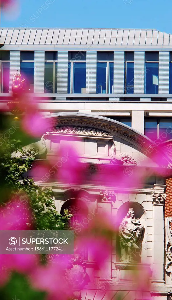 View of the London Stock Exchange seen across the 17th century Temple Bar Gate and some flowers on a sunny Summers day