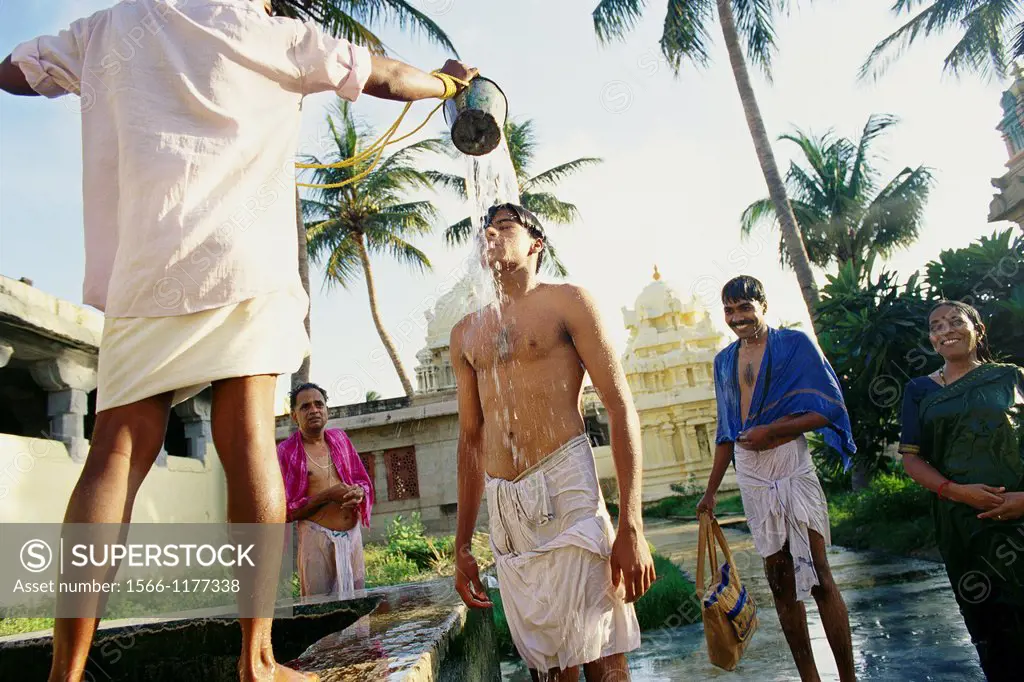 People stand in line to be anoited during a ritual in India at the Temple of A thousands Pillers  Indian Hindu pilgrims receive a cleansing as holywat...