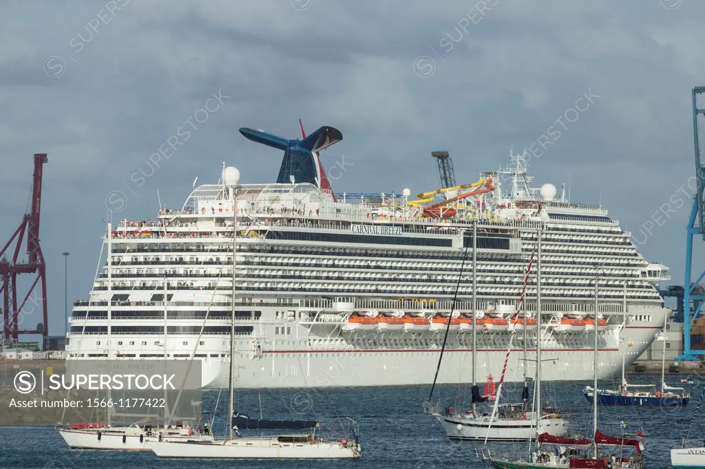 Cruise ship Carnival Breeze maneuvering leaving Las Palmas port on Gran Canaria, Canary Islands, Spain
