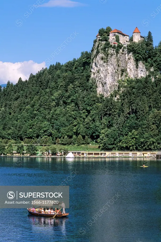 Slovenia Lake Bled Famous Castle and Small boat in resort town of Bled Slovenia