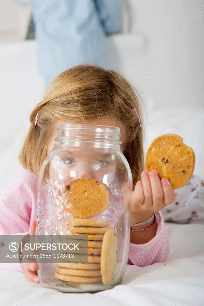 Girl with her hand in the cookie jar